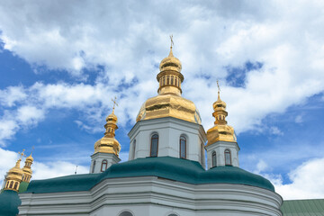 Fototapeta na wymiar Golden domes of the church in the Kiev-Pechersk Lavra, Ukraine