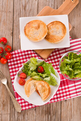 Puff pastry filled with tomato and mozzarella cheese.