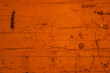 fond abstrait ou texture d'arrière-plan orange, vieille planche de bois nervurée, colorée et usée.