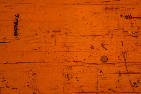 fond abstrait ou texture d'arrière-plan orange, vieille planche de bois nervurée, colorée et usée.