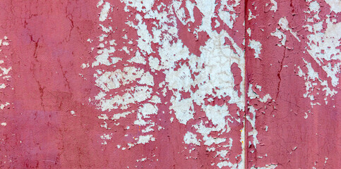 Old painted cracked wall as an abstract background.