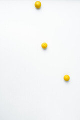 Minimal composition of tree yellow cherry plum on light background