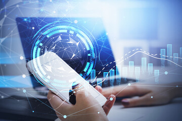 Businesswoman is holding smartphone with circle hologram at office workplace