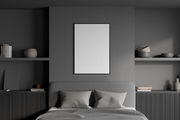 View of a headboard area in a grey bedroom with a poster