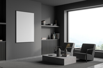 Corner view of dark grey armchairs with poster in modern living room