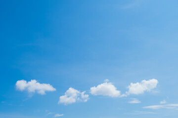 Beautiful clearly deep blue sky with white a little puffy clouds in a sunny day, copy space