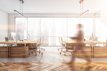 Fototapeta premium Blurred businessman wearing formal suit is walking inside office