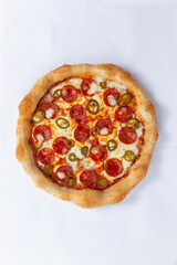 Homemade pizza isolated on white background. View from above.