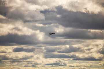 Beautiful view of helicopter in cloudy sky. Sweden. 