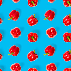 seamless pattern of bulgarian red pepper on blue background. paprika wallpaper, sweet pepper print pattern, top view, flat layout, isolated.