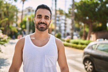 Hispanic sports man wearing workout style outdoors on a sunny day