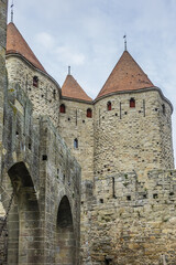 Fototapeta na wymiar Medieval citadel at Carcassonne - huge and completely over-the-top, encompassing no less than 53 towers, enormous concentric walls, surrounded by a moat. Aude department, region of Occitanie, France.