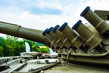 Military tank T-72 with smokestacks