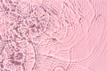 Texture of pink water under sunlight. Top view, flat lay