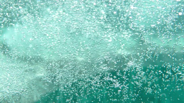 Air bubbles in water in swimming pool