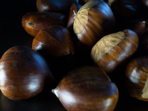 Close up view of chestnuts with black background