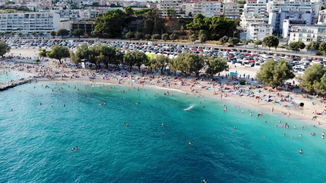 Drone view of the Croatian city of Split in the resort region of Dalmatia. Shot from a drone of a beach in Split. Croatia beach. People sunbathe on the beach view from a drone. Split architecture