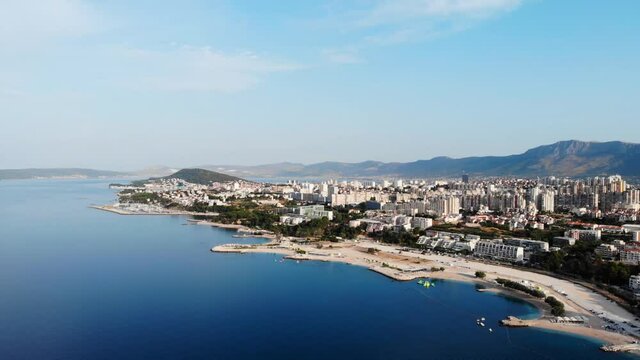 Drone view of the Croatian city of Split in the resort region of Dalmatia. Shot from a drone of a beach in Split. Croatia beach. Split architecture from drone. Pier with sea view