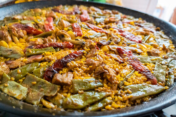 Close-up of a typical Valencian paella, freshly made and ready to eat.