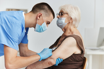 Fototapeta premium elderly woman in hospital vaccine passport health care