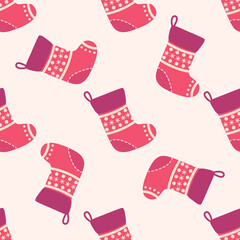 Christmas seamless pattern with red Christmas socks with snowflakes