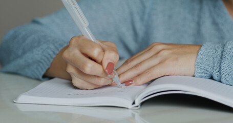 Woman write on note book