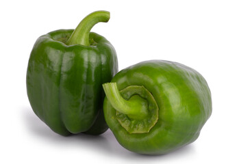 Two green bell peppers isolated on a white background