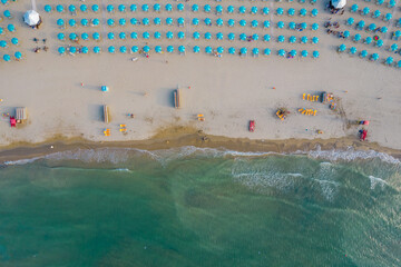 Aerial photo of Rimini coastline with many beach umbrellas in the beach