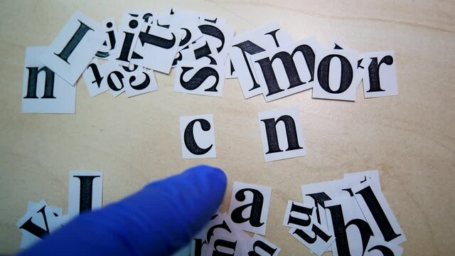 printed on paper letters make up the word i can on table paper scraps