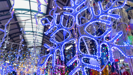 Obraz premium Christmas decorations in the form of large bright snowflakes. Christmas concepts. Xmas background. Space for text.