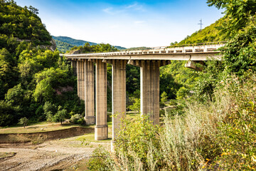 Fototapeta na wymiar Arkala river bridge at the entrance to Ananuri Fortress Complex on the Aragvi River in Georgia