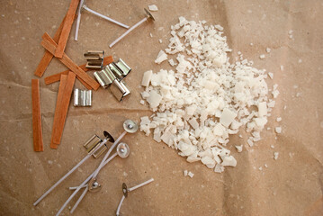 Soy wax and two types of wicks : wood and cotton on the background of kraft paper. Candle Making.
