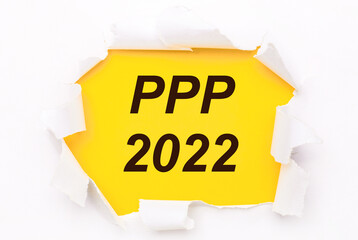 Torn white paper lies on a bright yellow background with the text PPP 2022