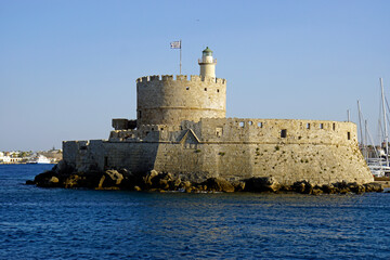 old fortress at mandraki harbor in rhodes