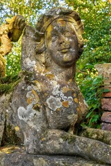 Detail of an old weathered sphinx sculpture. Itlingen Castle, North Rhine-Westphalia, Germany