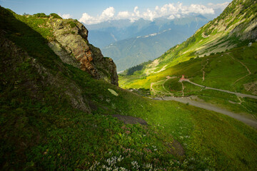 mountain climbing alp in summer,landscape of meadows and fields from the peaks, hiking and adventure trips