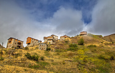 Fototapeta na wymiar Stone and wooden houses of mountain villages at the foot of the Southern Kaçkars