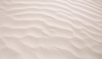 Abstract background of sandy sea on the beach. Wave sand texture - obrazy, fototapety, plakaty