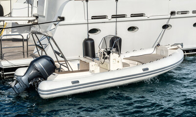 Motor boat near the yacht.