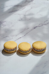 Traditional Argentinian alfajores with dulce de leche on marble table. Argentine gastronomy concept.