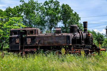 Fototapeta na wymiar The old steam locomotive is parked in a depot 