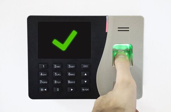 Biometric Fingerprint Scanner. Thumb on fingerprint. access control verified. successful entrance.