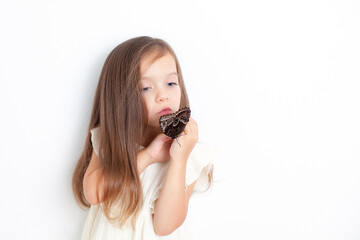 A sweet girl holds a morpho butterfly in her hands and examines it. White background, space for text. The study of nature. Respect.