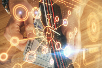 Multi exposure of social network theme drawing hologram and USA dollars bills and man hands.