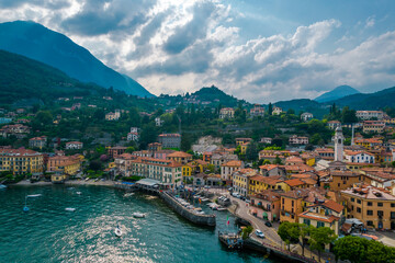 Naklejka na ściany i meble Aerial view of Menaggio village on a coast of Como lake, Italy on a cloudy day