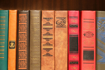 row of old books, bookshelf, library
