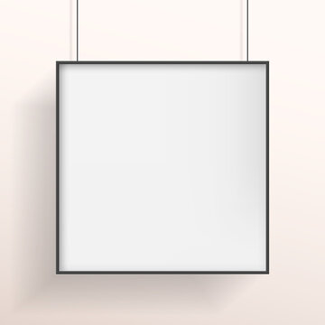 White poster or bilboard with black frame hanging on white wall