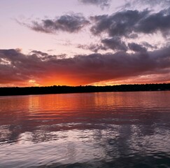 Fototapeta na wymiar Beautiful late summer sunset over lake