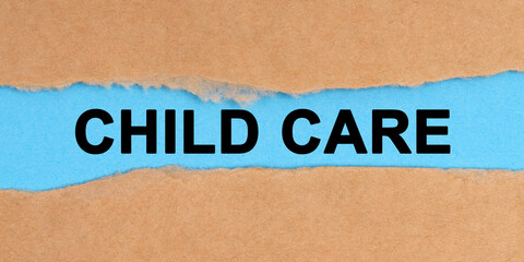 The paper is ripped in the middle. Inside on a blue background it is written - Child Care