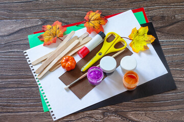 Instructions, step 1. Halloween ghost and vampire toy gift stics puppets on wooden table. Handmade. Project of children's creativity, handicrafts, crafts for kids.